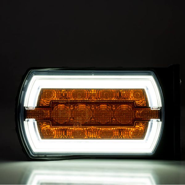 Phare LED avec support latéral avec feu de position néon et feu clignotant A 1 CleoFront 12V 24V