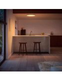Panel LED inteligente Surimu Philips Hue WA Redondo blanco en un salón