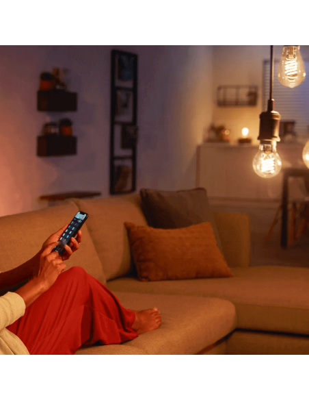 Bombilla inteligente Philips Hue 7W 2100K 550lm E27 filamento Edison foto ambiente