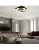 Plafón de techo Caya espiral negro encendido en un salón| LeonLeds