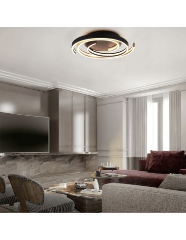 Plafón de techo Caya espiral negro encendido en un salón| LeonLeds