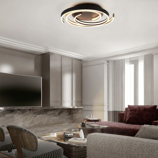 Plafón de techo Caya espiral negro encendido en un salón| LeonLeds