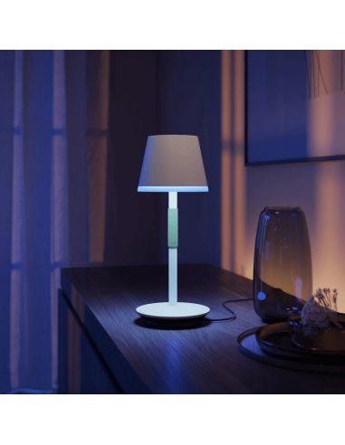 Lámpara de mesa portátil LED inteligente Hue Go blanco en una mesa