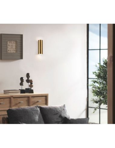 Applique murale MARLEY en bronze antique sur un mur