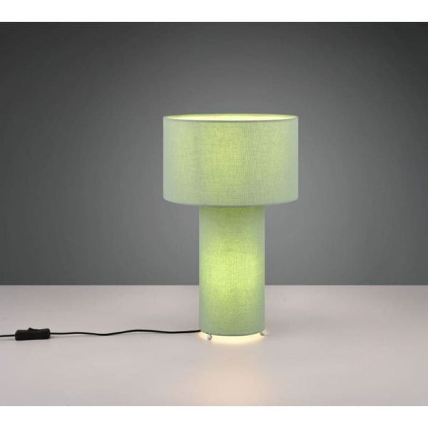 Candeeiro de mesa BALE com abajur de tecido verde e corpo sobre uma mesa