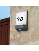 Applique d'extérieur LED KASAI avec capteur d'obscurité sur un mur