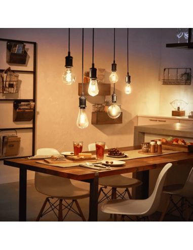 Bombilla inteligente 7W 550lm Philips Globo 2100K G93 E27 en un comedor